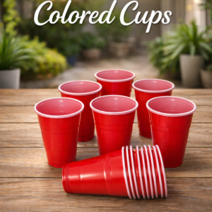 Disposable colored plastic cups arranged on a table for parties and events